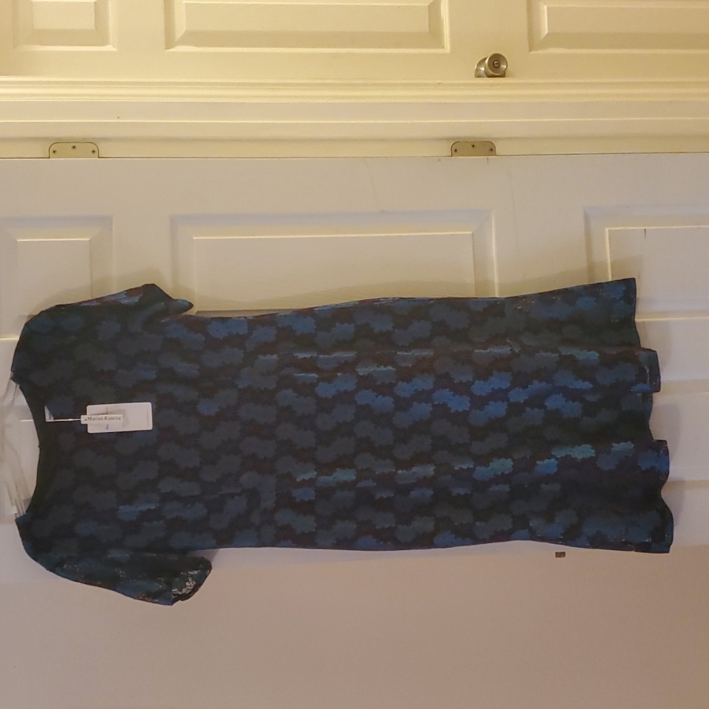 This dress can be worn to an event, church, a party, etc. The tail is flared.